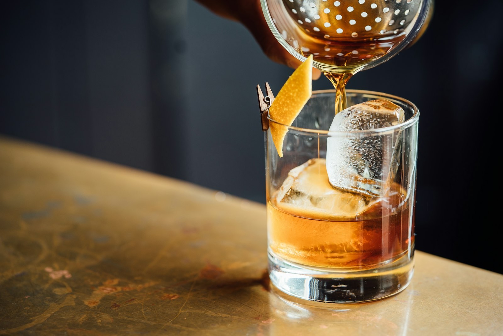 A whisky being poured at The Salon — the casino lounge at Optionventurebeam